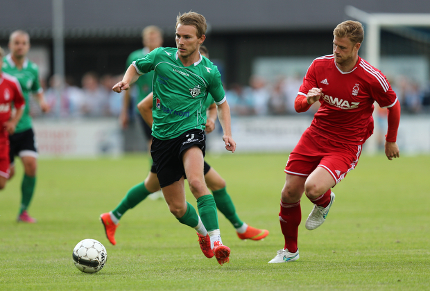 FOOTBALL: Anders Holst (FC Helsing¿r) is closed down by Matt Mills (Nottingham Forest) during the pre-season match between FC Helsing¿r and Nottingham Forest at Helsing¿r Stadion on July 14, 2015 in Helsing¿r, Denmark. Photo: Claus Birch / ClausBirch.dk